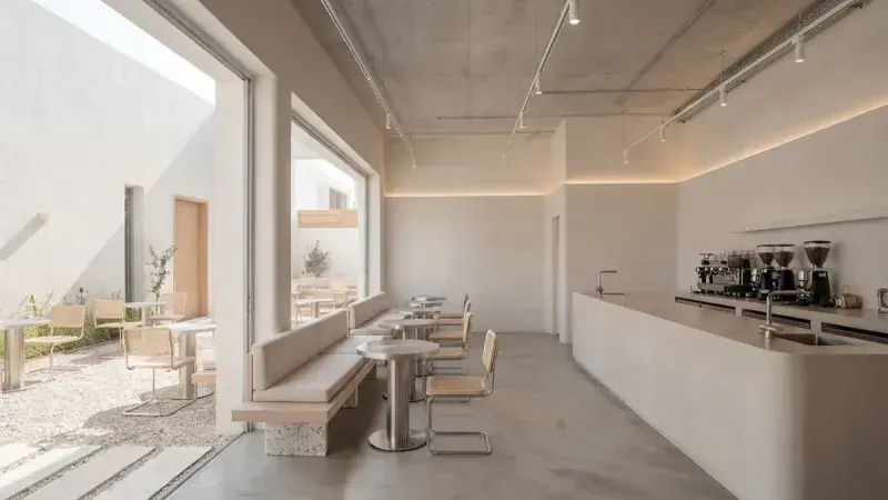 Minimal coffee shop with a curved counter example