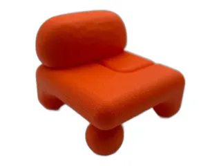 Example furniture photo: a bright orange low lounge chair with ball feet