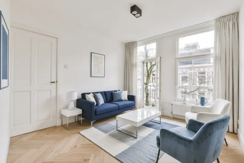 Living Room designed with MeltFlex AI: European Apartment, Blue Sofa Version