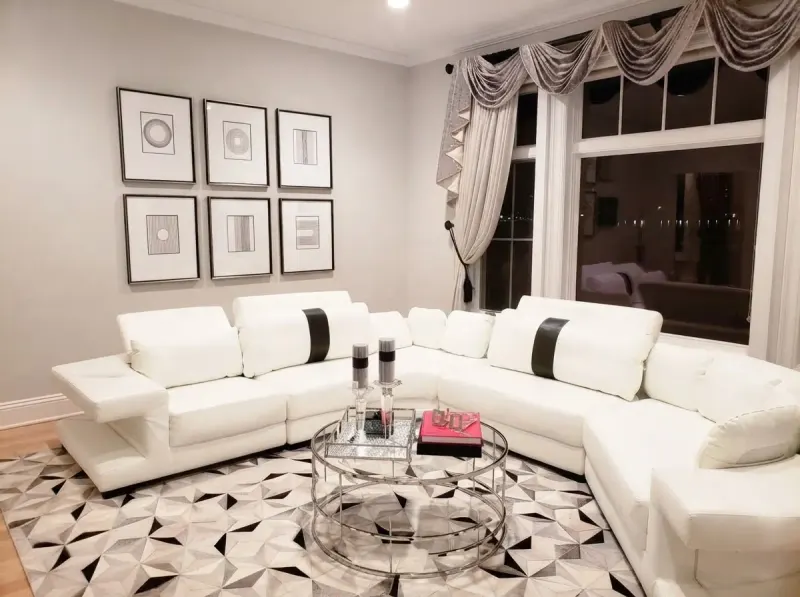 Living Room designed with MeltFlex AI: White Sofa, Grid Gallery Wall