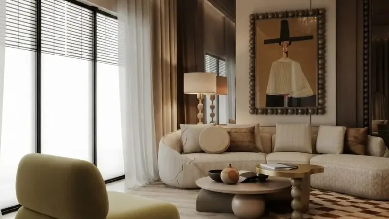 Bright neutral living room staged with a cream sofa and framed art