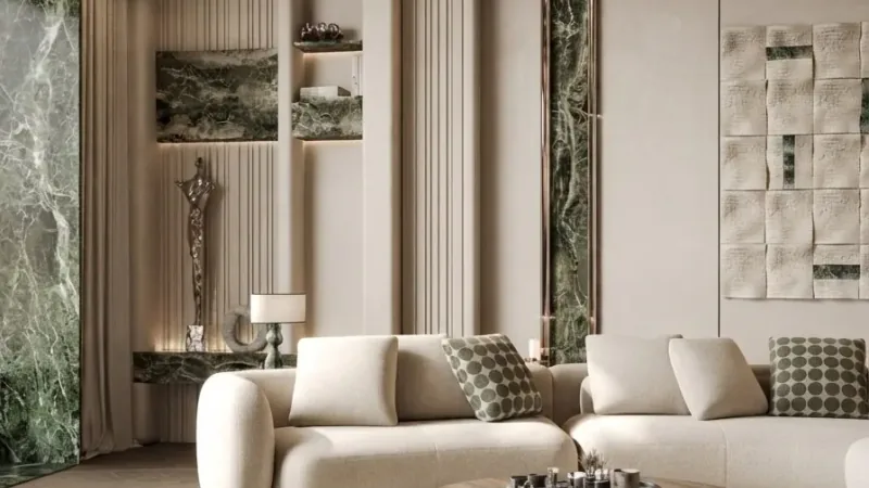 Soft minimalist living room staged with a white sofa and green marble accents