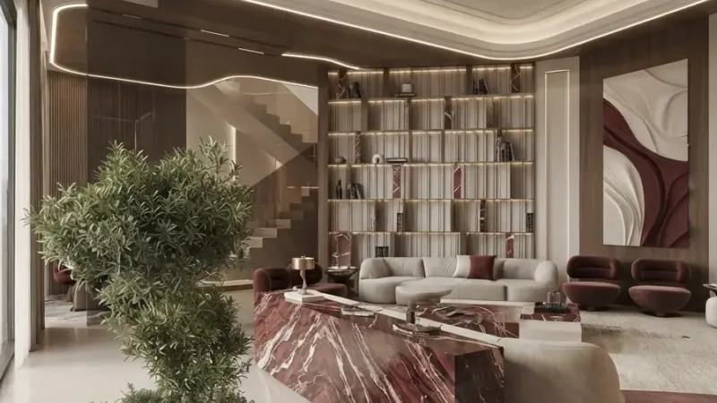 Villa reception staged with curved sofas, a marble bar and a statement tree