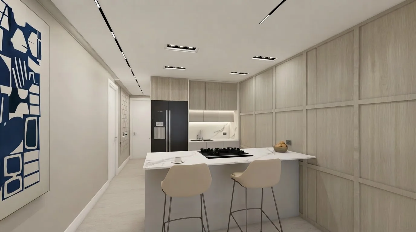 Galley kitchen with pale wood cabinets, a white island and two stools, walls in Agreeable Gray