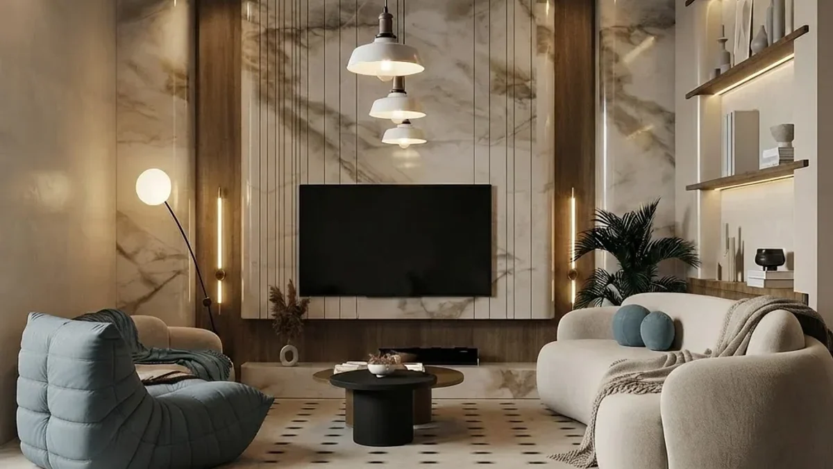 Basement family room with a marble-look media wall, a wall-mounted TV between vertical oak slats with light strips, lit floating shelves, a cream boucle sofa, a blue lounge chair, stacked pendant lights and a patterned tile floor