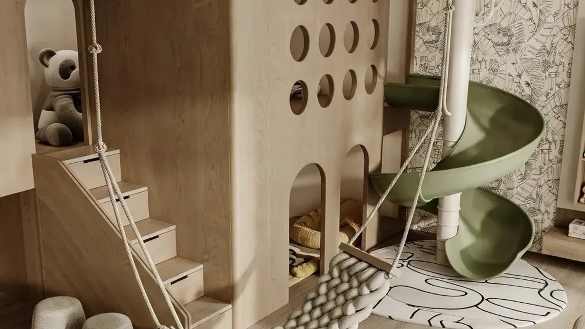 Basement playroom with a pale wood play tower with round windows, steps and a rope swing, a green spiral slide, a line-drawing wallpaper and a soft patterned rug