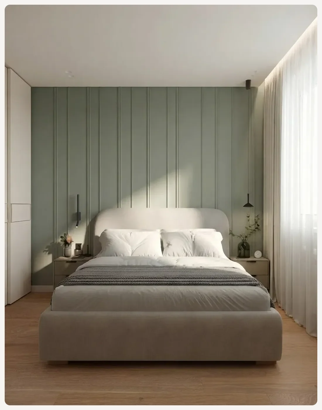 Bedroom with the wall behind the bed painted a mid-depth sage green and every other surface in a warm off-white
