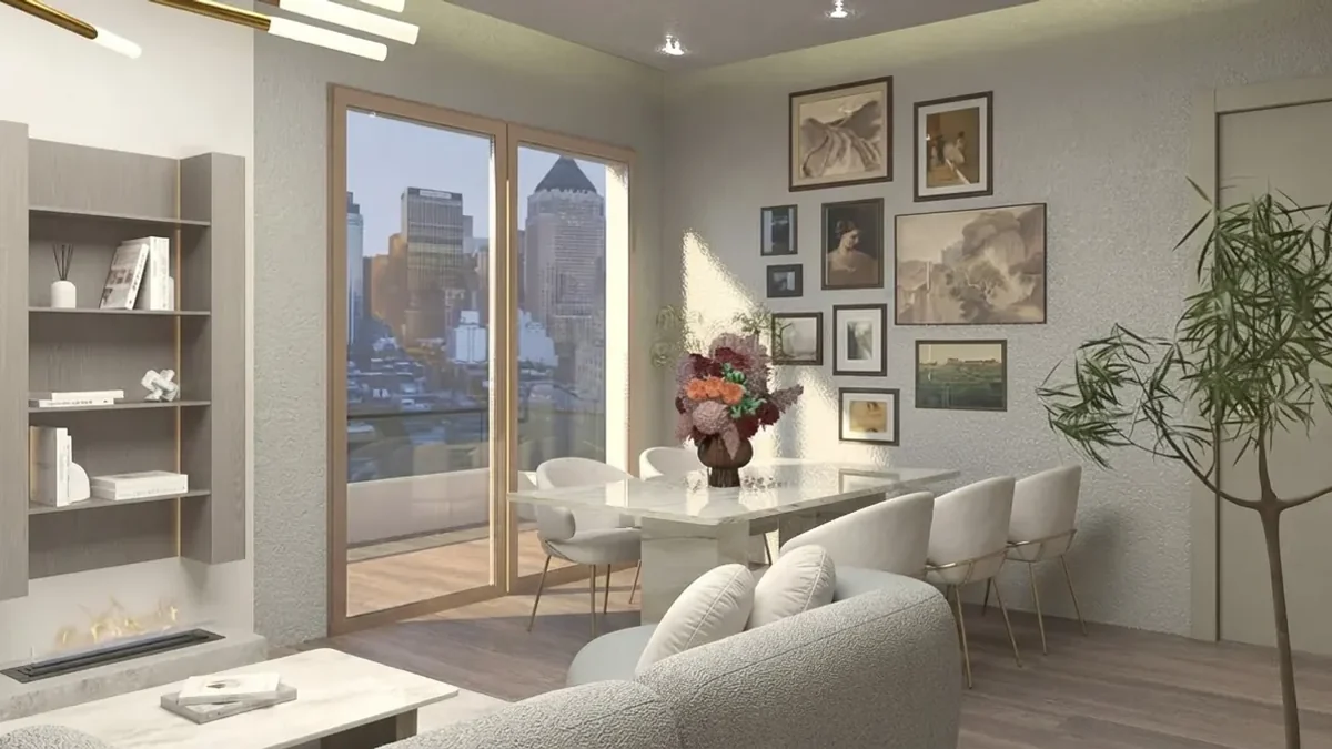 Bright dining corner with white chairs, a bouquet on the table, a city skyline in the window and a tidy grid of six small framed prints on the wall beside it