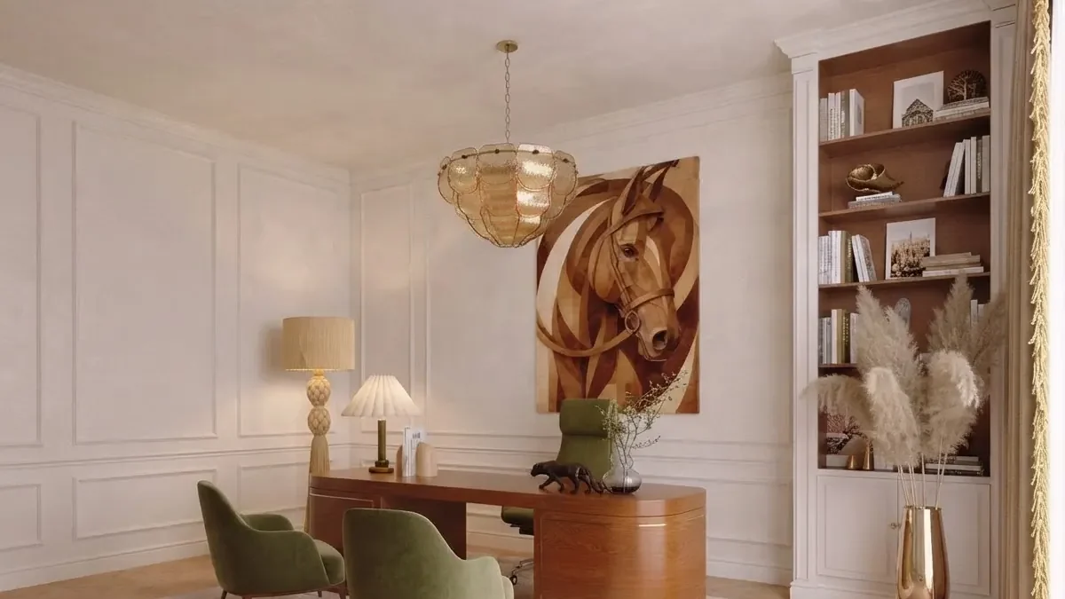 Classic home office with cream panelled walls, a curved walnut desk, green velvet chairs and one large painting of horses hung on the wall behind the desk