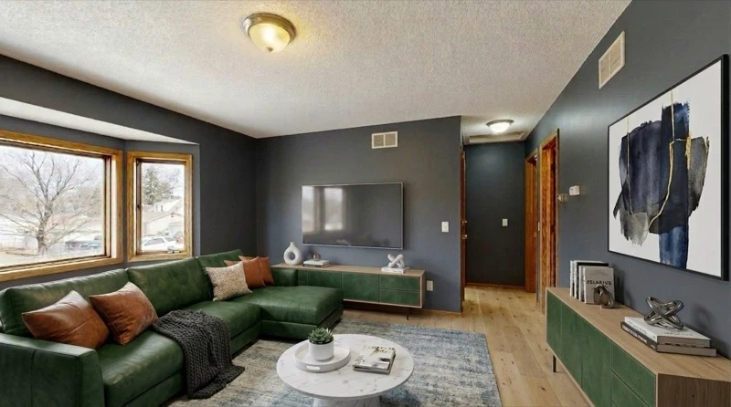 Living room with grey walls and warm-toned furniture showing how furniture color choice transforms the feel of a grey room