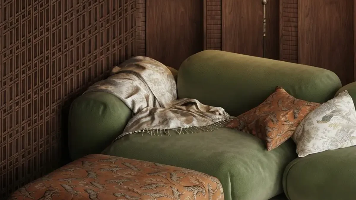 Earthy lounge corner design idea: a moss green modular sofa with rust and patterned cushions against dark fretwork wood panelling