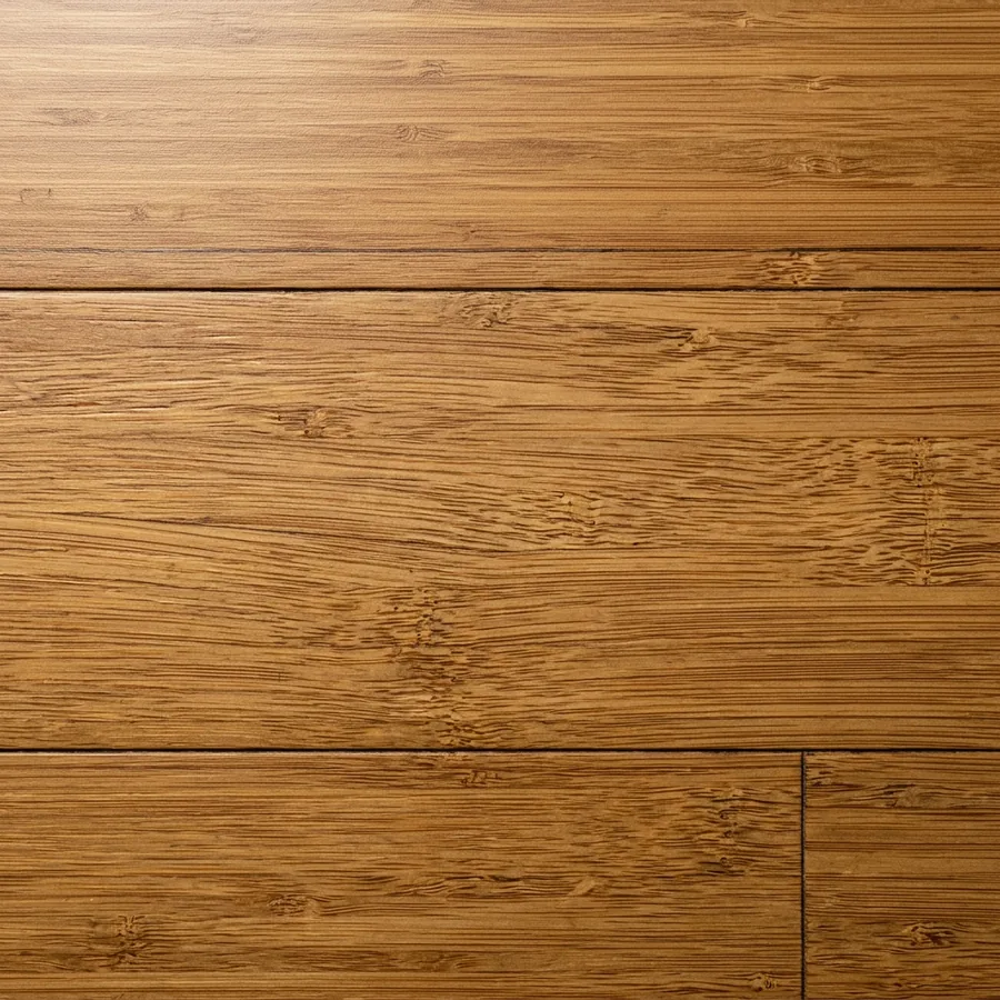 Close-up texture swatch of strand-woven bamboo flooring in carbonized caramel with tight fiber striations