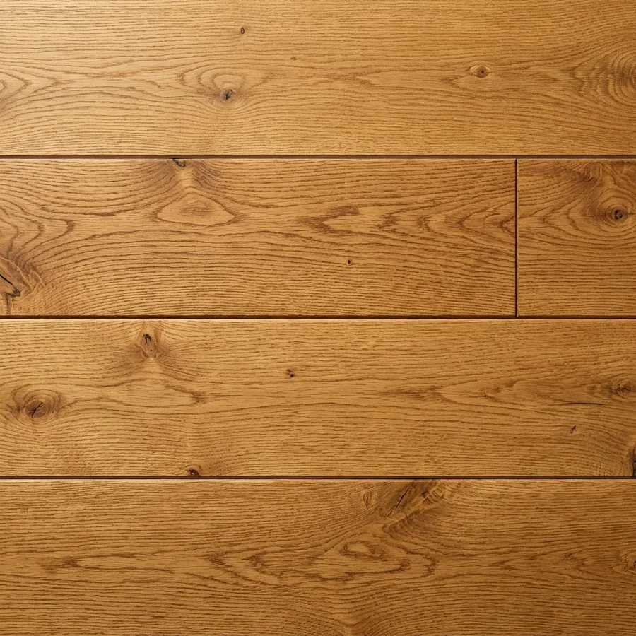 Close-up texture swatch of wide-plank golden oak hardwood flooring with honey and amber tones and cathedral grain