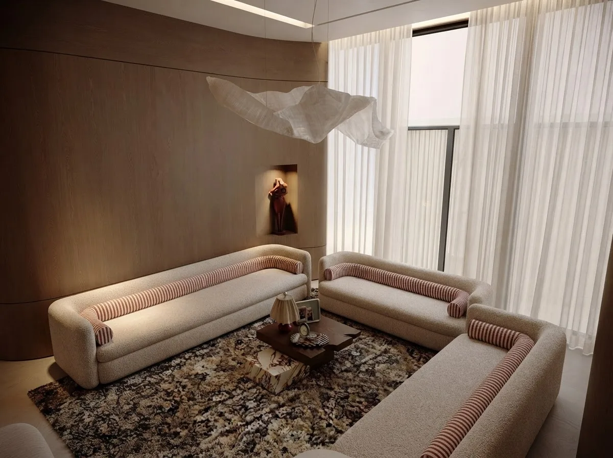 Long cream boucle sofa on a dark patterned rug, a textured weave that shows water rings badly