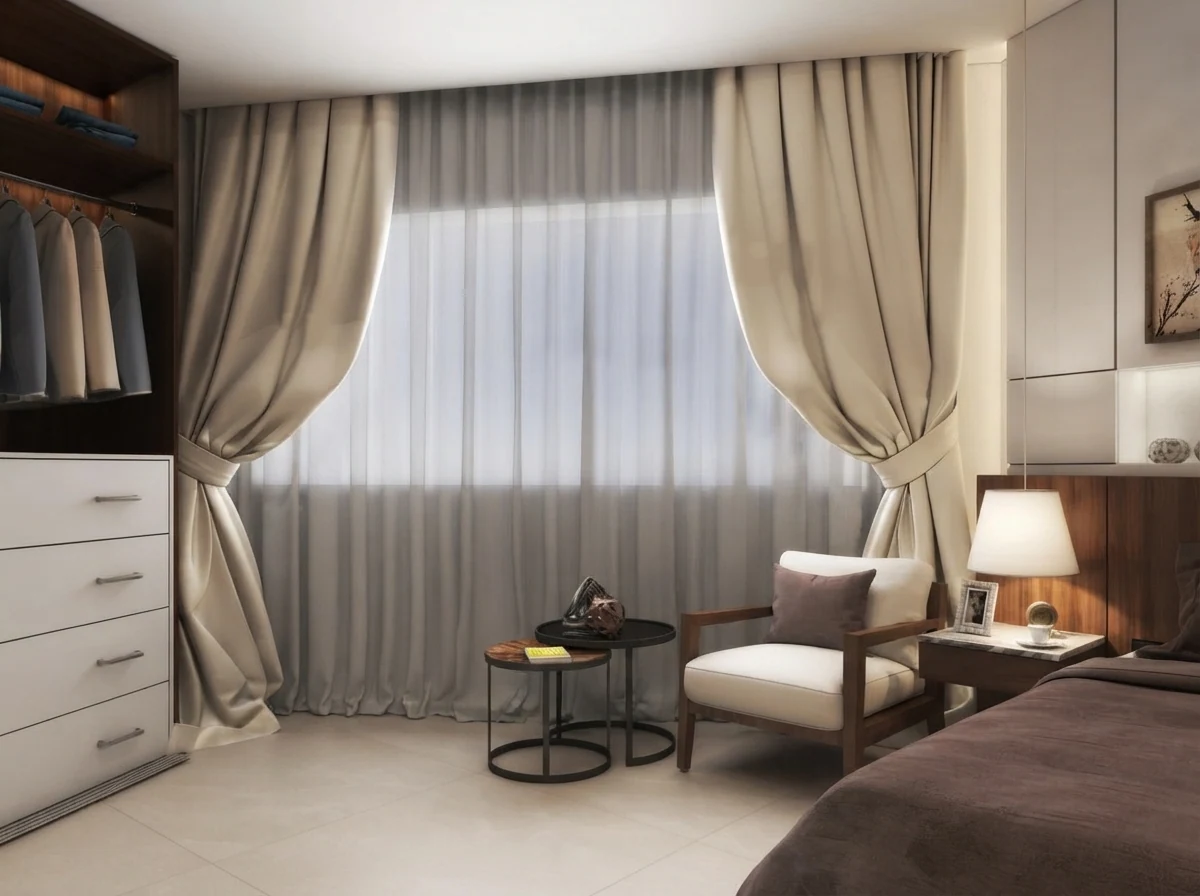 Elegant bedroom corner render with taupe drapes and grey sheers beside a white wardrobe and an armchair in warm lamp light