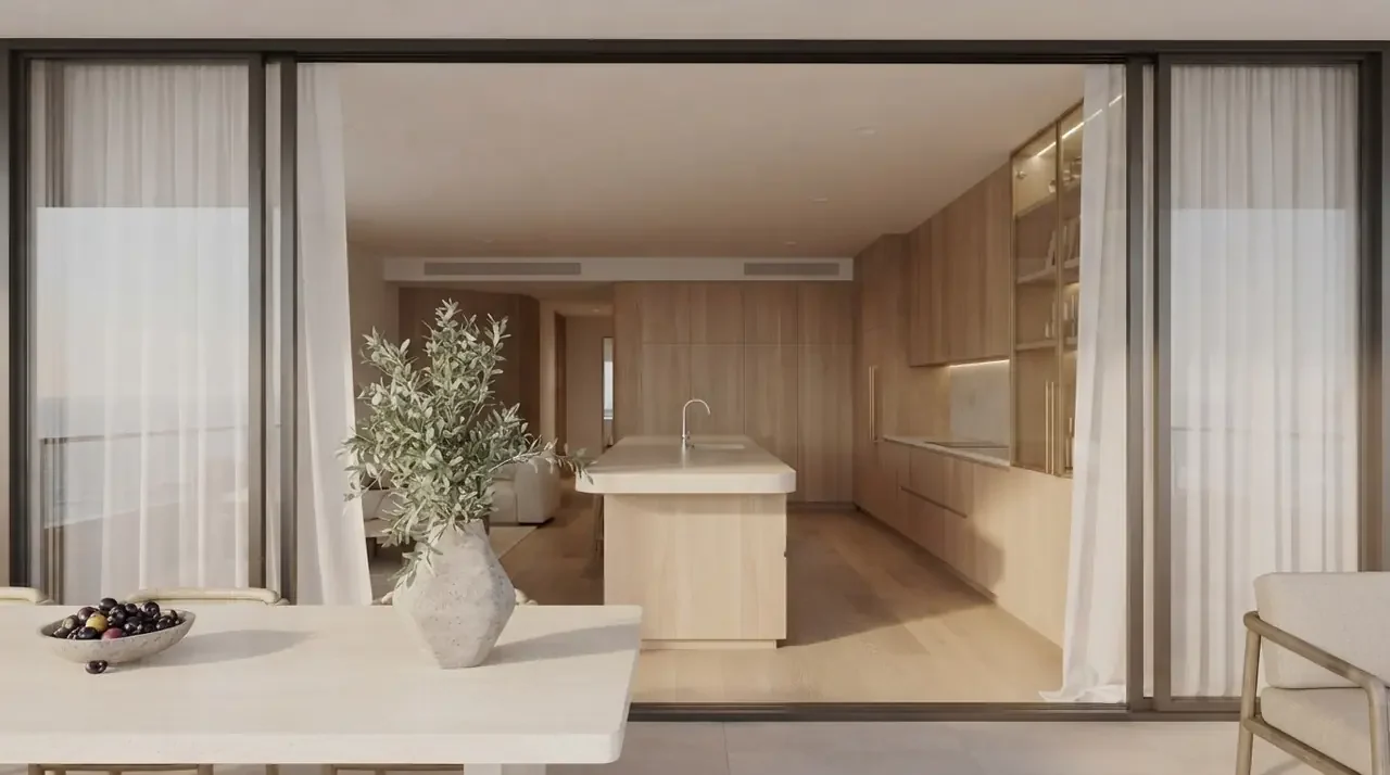 Wide glazed opening between two rooms with sheer panels hanging at both edges, gathered clear of the glass