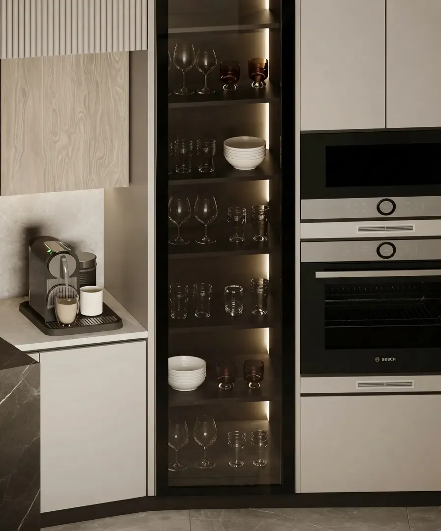 A greige modern kitchen with tall integrated units and a glazed display cabinet