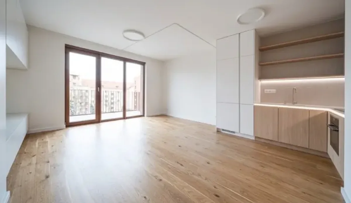 An empty room with bare walls and a wooden floor, the starting point uploaded by a shopper before adding furniture