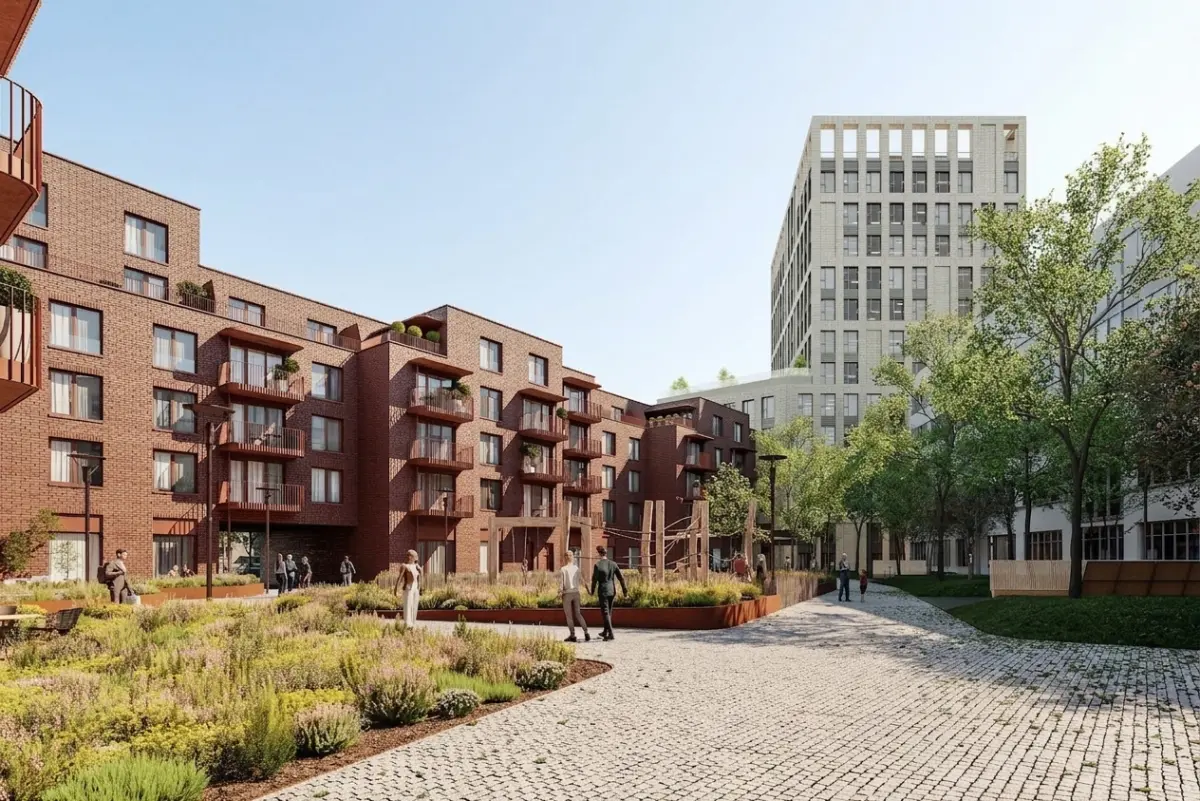 Architectural render of YIT Zwirn project courtyard in Bratislava showing brick residential buildings with balconies, landscaped gardens, cobblestone paths, and pedestrians on a sunny day