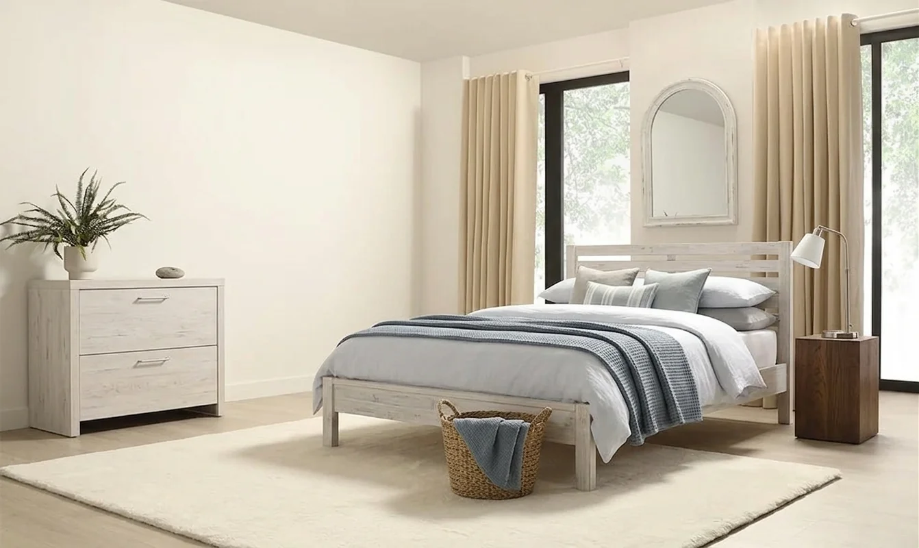 AI-generated coastal bedroom with white textured headboard, layered blue and white striped bedding, woven laundry basket, potted plant, and arched mirror