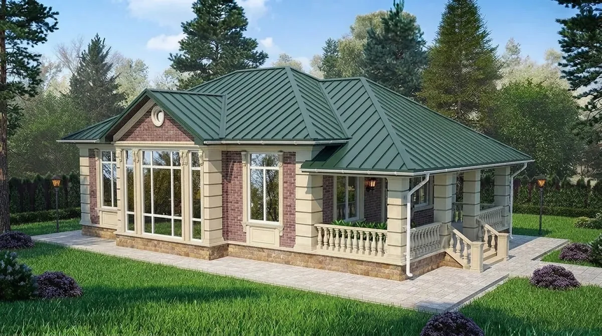 The same red brick ranch re-roofed in dark forest green standing seam metal roofing