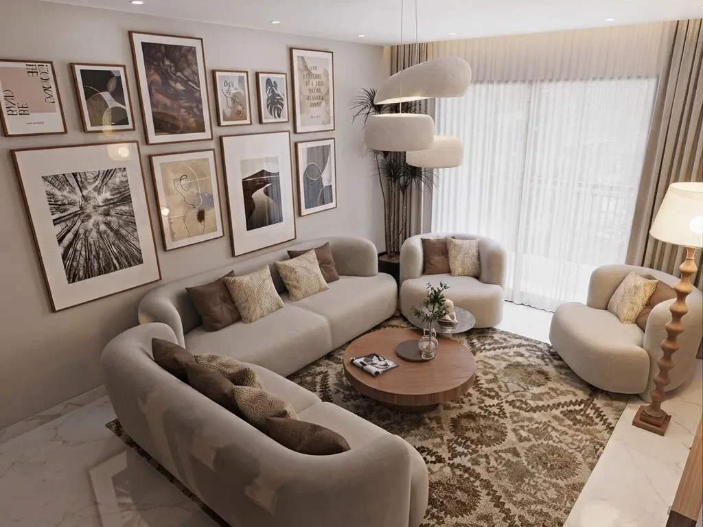 Lounge with a large gallery wall of black and white and earth tone framed prints above a curved cream sofa, a patterned rug, a round wood coffee table and a sculptural floor lamp