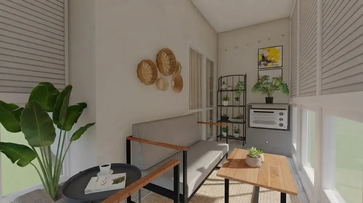 Small balcony decorated with a large banana leaf plant, woven wall baskets, a black metal plant shelf with potted greenery, a gray loveseat and a wood coffee table