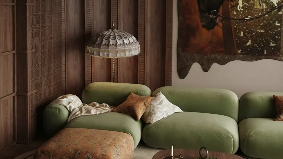 Earthy seventies living room makeover result: a moss green modular sofa with rust cushions under a woven pendant, warm wood panelling behind