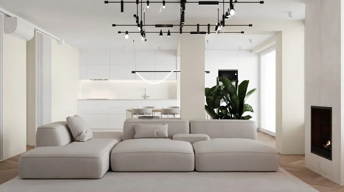 Warm minimalist living room with a low modular sofa, a tall plant and a linear pendant, walls in Alabaster