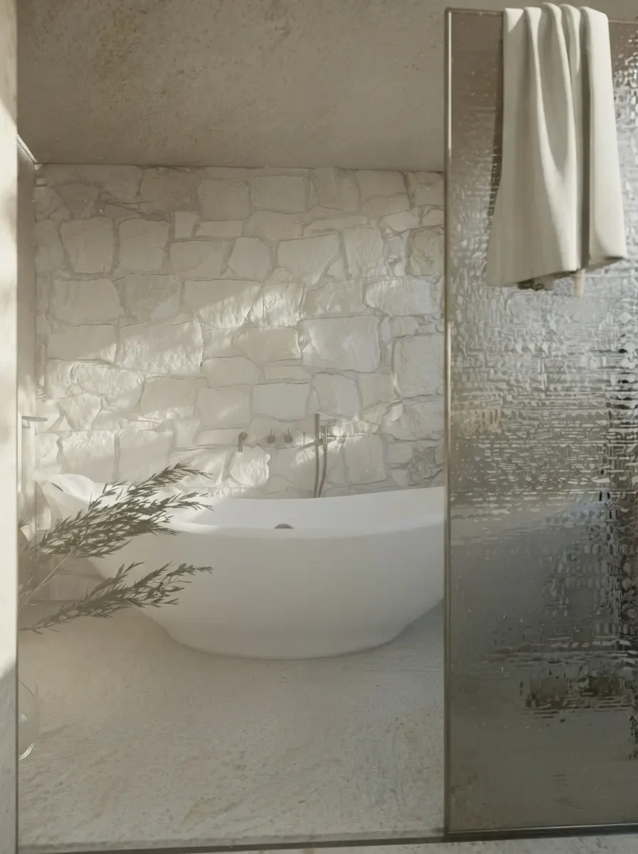 Narrow bathroom render with a walk-in shower behind a full-height fixed glass panel, rough stone feature wall and a slim freestanding tub beyond, olive branches in the shower