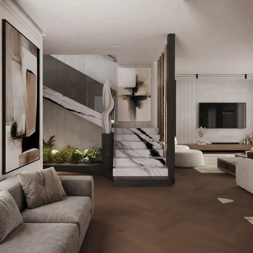 A living room with a pale marble staircase rising behind a dark partition, planting at its base and a low sofa in front