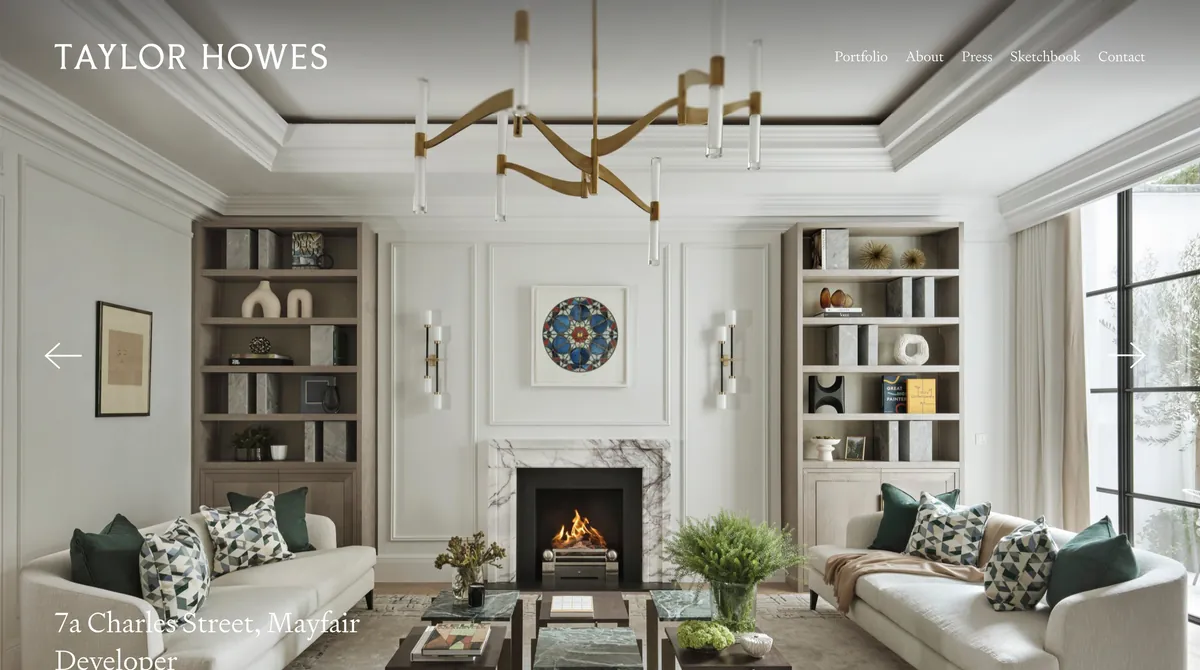 Screenshot of the Taylor Howes website showing an elegant living room with a chandelier and fireplace