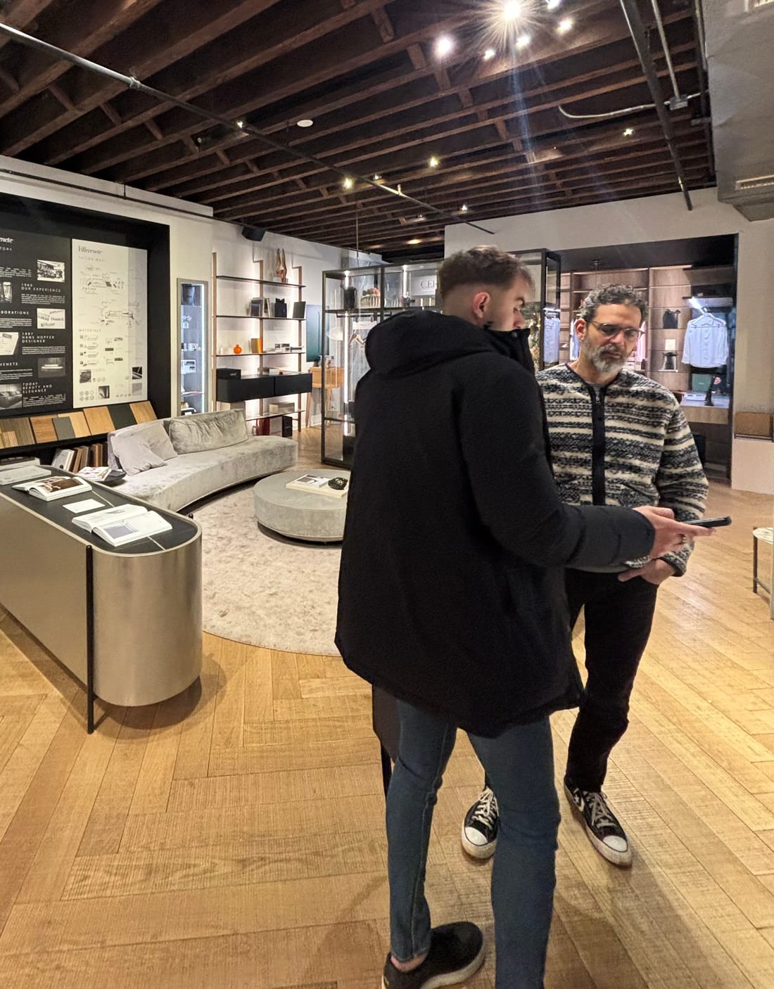 MeltFlex co-founder demoing the AI interior design tool to a furniture showroom owner in New York