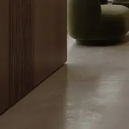 curved green armchair