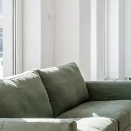 green linen sofa