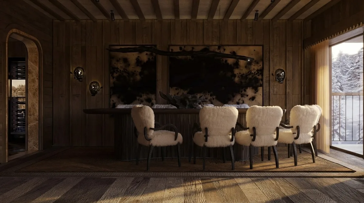 Chalet bar area with a dark stone slab counter, four sheepskin bar stools, an arched opening to a wine store on the left and a snowy window on the right