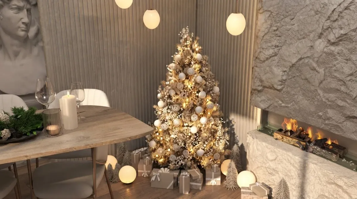 Cream living room with a gold ornament Christmas tree standing immediately beside a lit linear fireplace in a stone wall, lit globes and gifts at its base and a dining table in the foreground