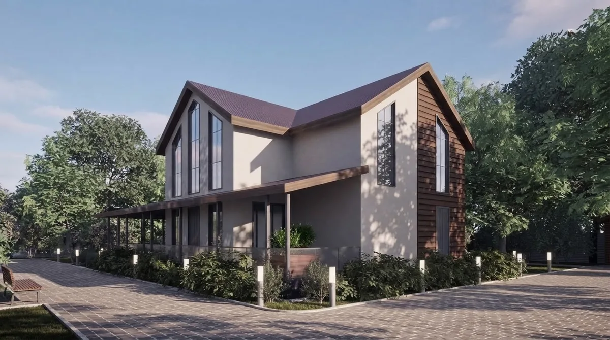 Modern gabled family house in daylight with dark timber cladding, a steep roof, tall glazing, a covered porch, low shrubs and a paved driveway with path bollards, used as the test input