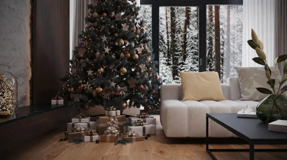 Living room with a decorated Christmas tree placed directly in front of a floor to ceiling glass wall onto a snowy forest, a cream sofa, a black coffee table and a dark fireplace wall to the right