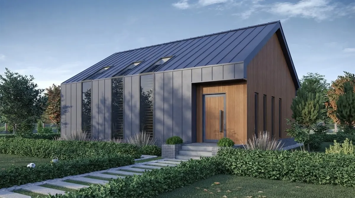 Modern barn house with a dark gray standing seam metal roof that continues down the walls and a timber clad entrance