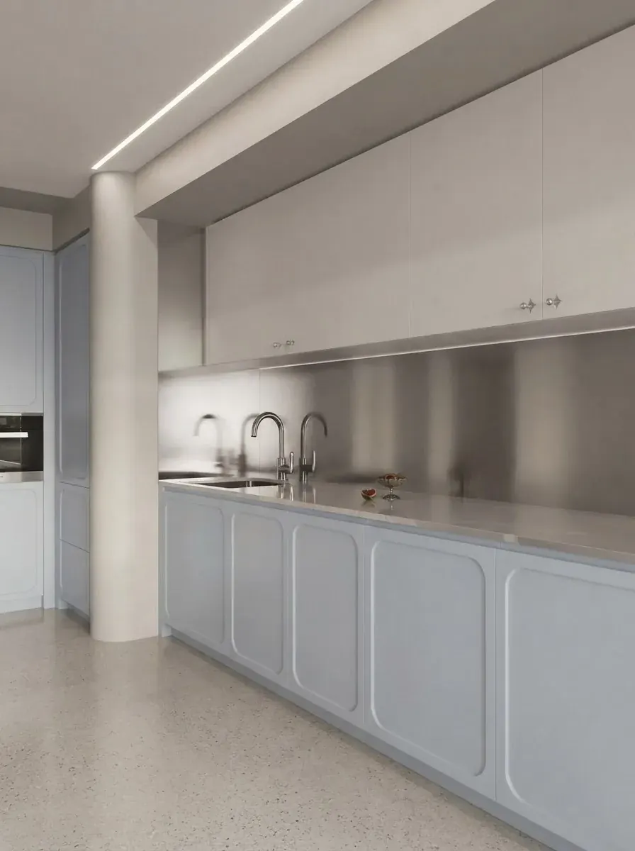 Compact kitchen with white lower cabinet doors that have an arched routed panel pattern, a steel backsplash, a long steel countertop and pale blue walls