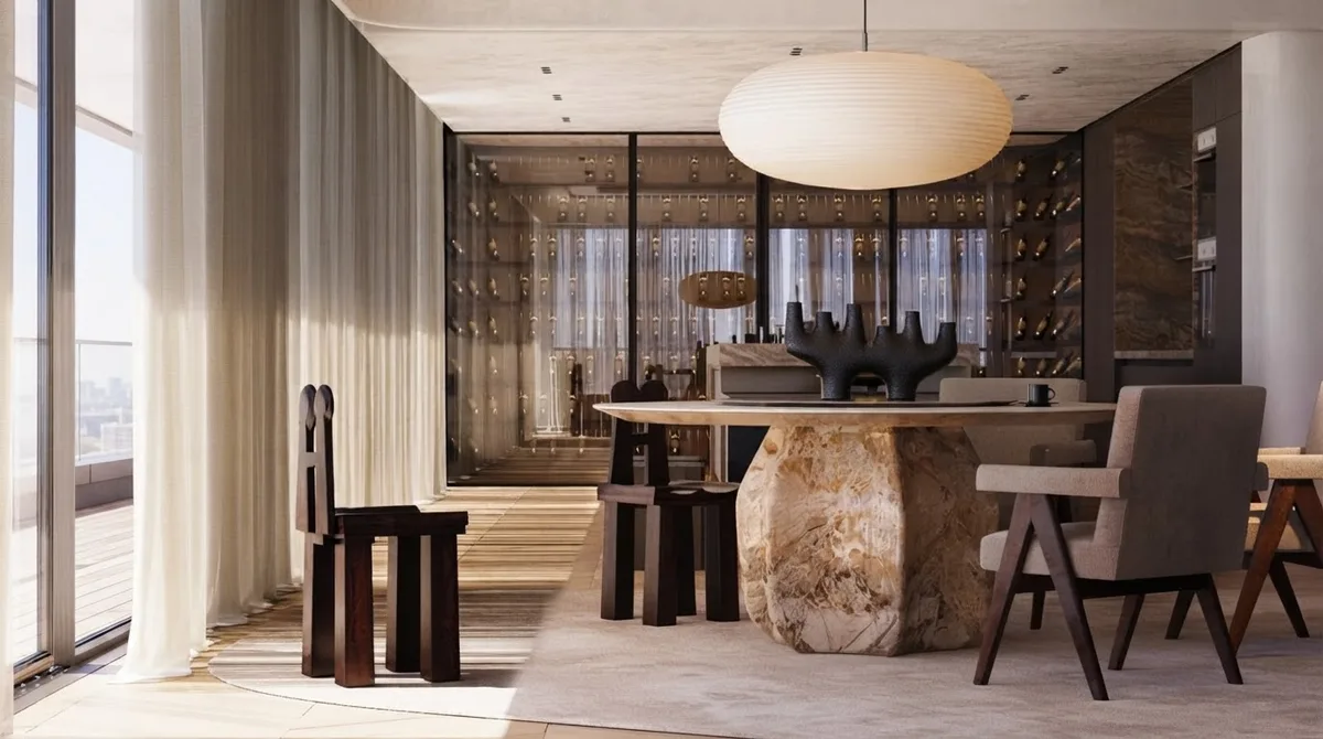 Sardinian apartment with a round oak dining table, cane dining chairs, a curved sofa and a paper pendant lamp
