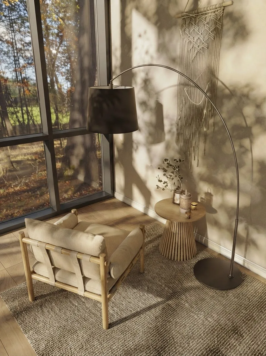 Sunlit three season sunroom with a full height glazed wall, a low timber lounge chair, a round side table and autumn birch trees outside