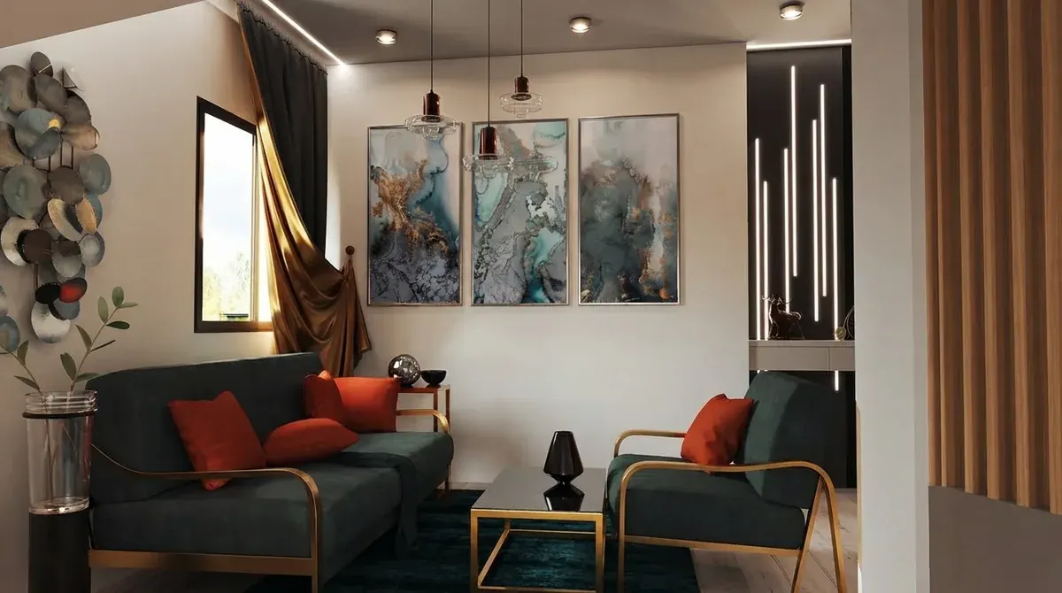 The same teal living room seen from a different angle, showing the pendant lights above the seating, the same three turquoise artworks and the same gold framed coffee table