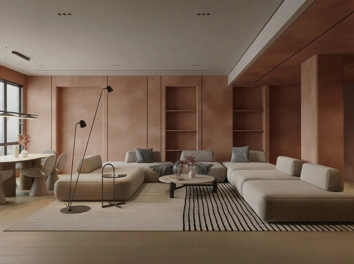Open living room where one large striped rug runs under both sofas and the coffee table, with bare wood floor showing around all four edges